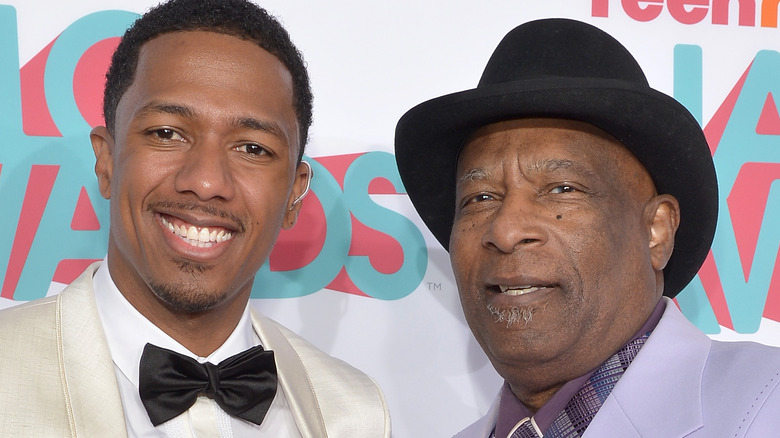 Nick Cannon posing with his grandfather 