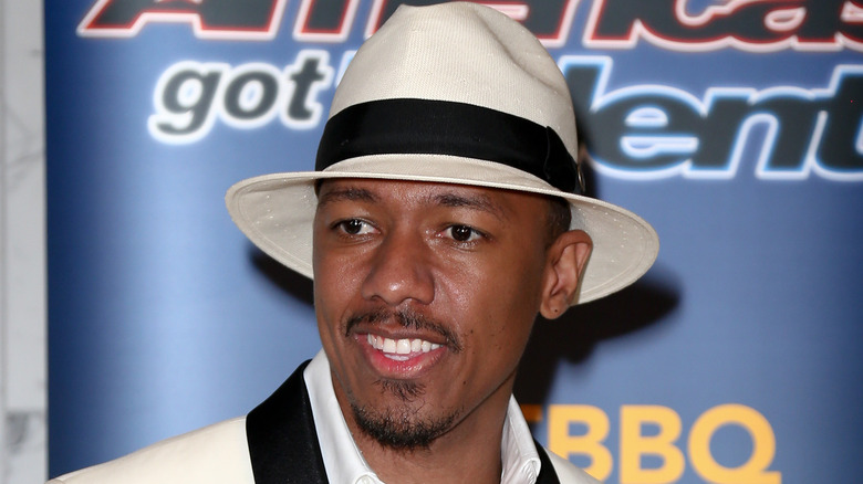 Nick Cannon posing on America's Got Talent's red carpet