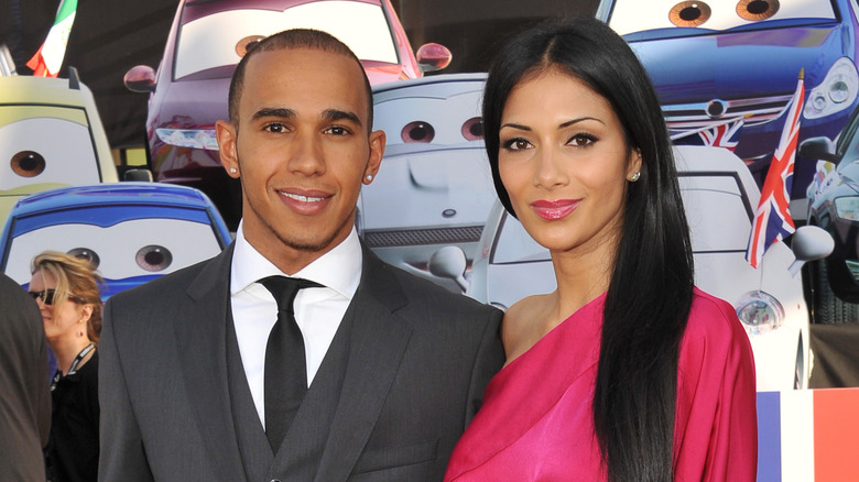 Lewis Hamilton and Nicole Scherzinger smiling