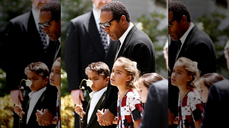 O.J. Simpson and his children, Sydney and Justin, walking