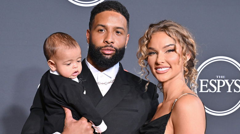 Odell Beckham Jr. posing with Lauren Wood and their son