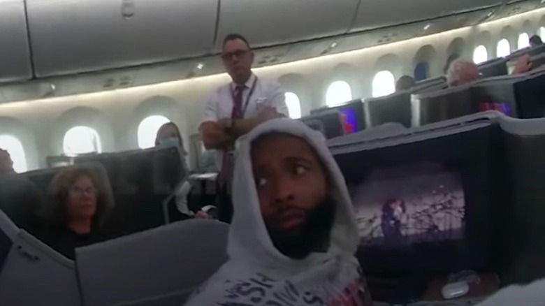 Odell Beckham Jr. being escorted off airplane