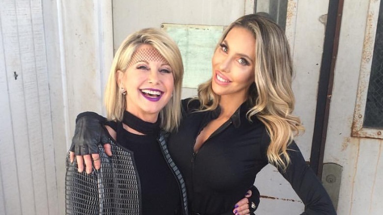 Olivia Newton-John posing with her daughter