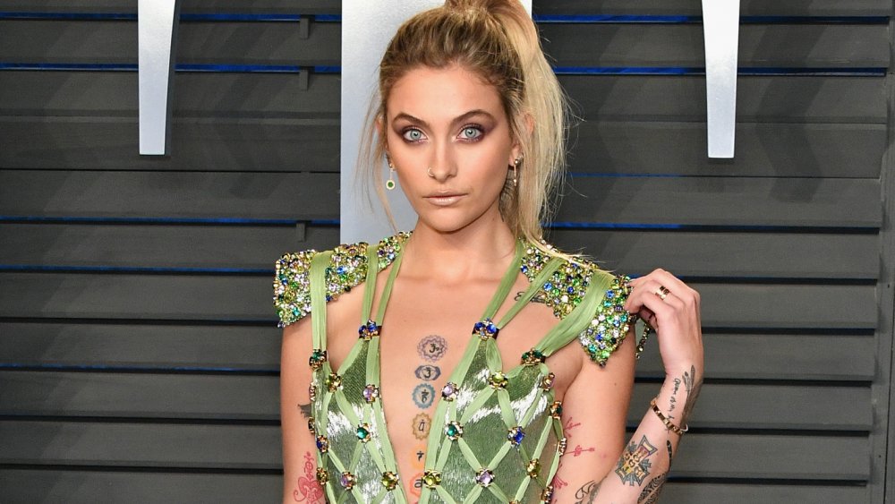 Paris Jackson in a green dress with precious gems on it