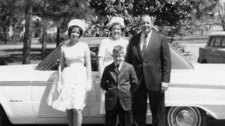 Paula Deen posing with her mother, father, and brother