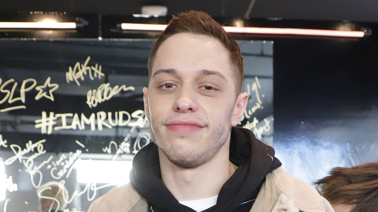 Pete Davidson smiles