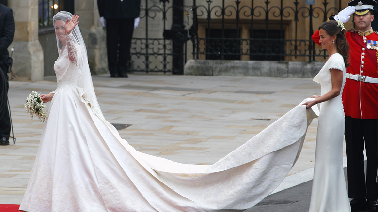 Pippa Middleton holding Kate Middleton's train 