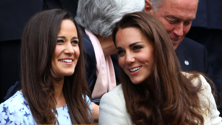 Pippa and Kate Middleton smiling