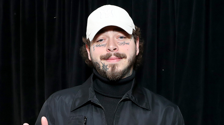 Post Malone in white baseball cap