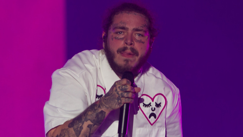 Post Malone holding microphone 