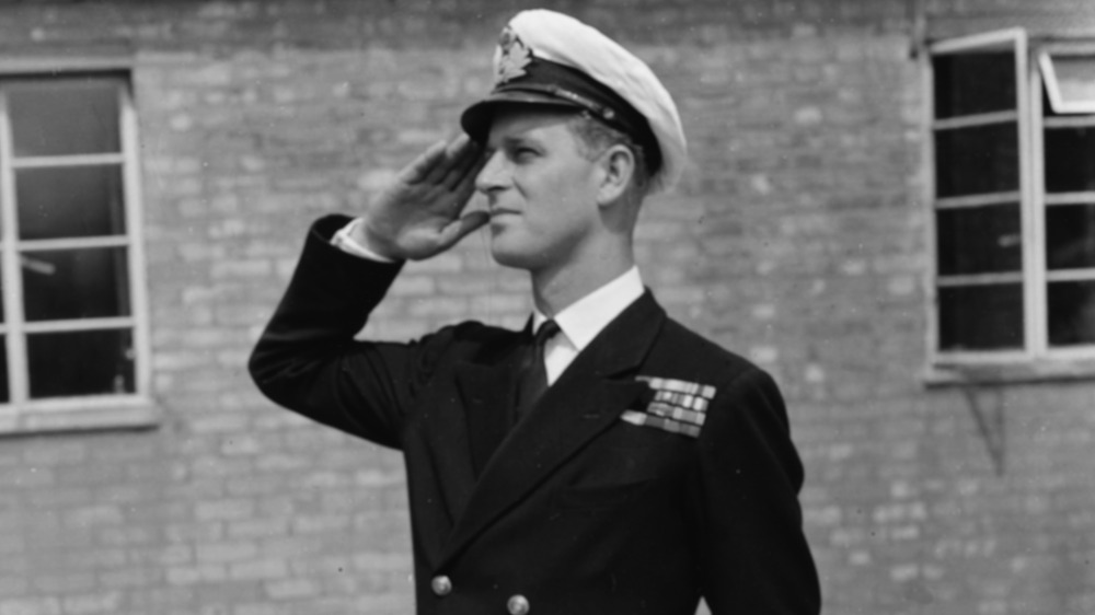 A young Prince Philip saluting
