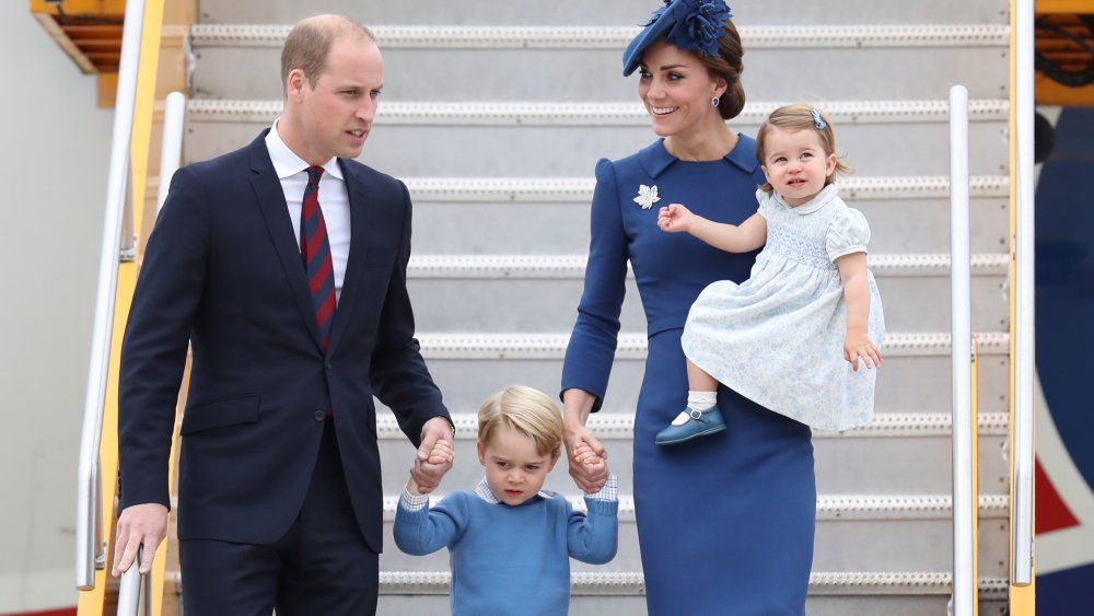 Prince William, Prince George, Kate Middleton, Princess Charlotte stepping off a plane