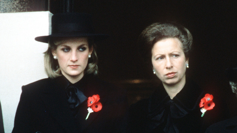 Princess Diana and Princess Anne standing together