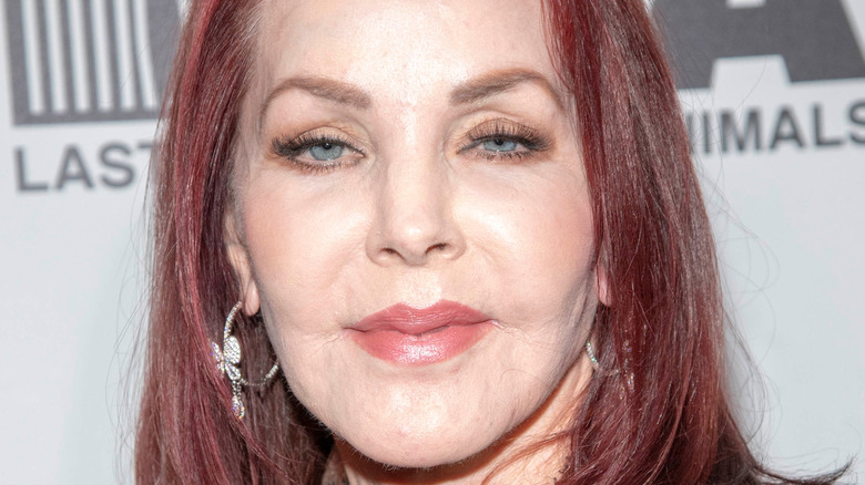 Priscilla Presley wearing silver earrings