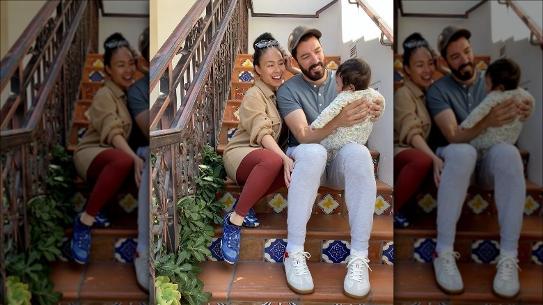 Drew Scott and Linda Phan pose with son