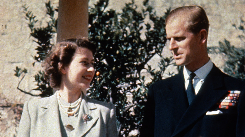 Queen Elizabeth and Prince Philip at an event 