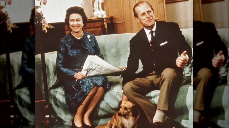 Queen Elizabeth and Prince Philip with a dog