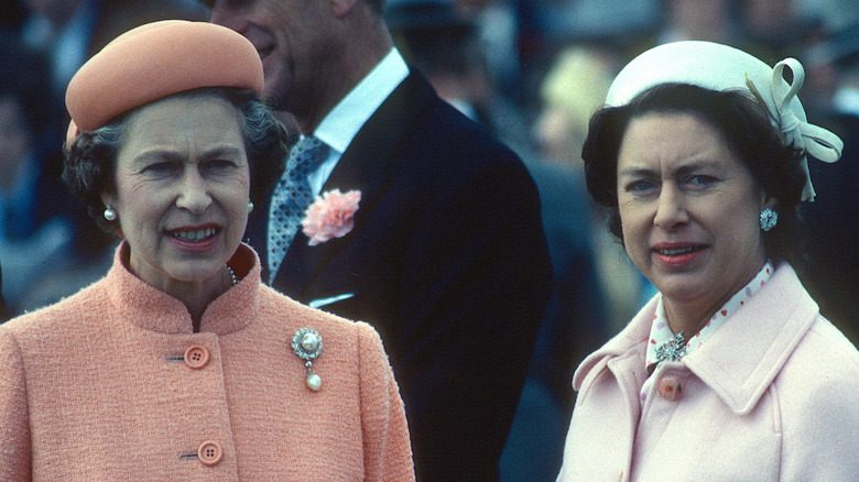 Queen Elizabeth and Princess Margaret at an event 