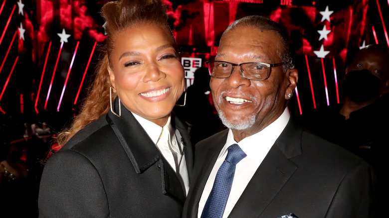 Queen Latifah and her dad smiling 