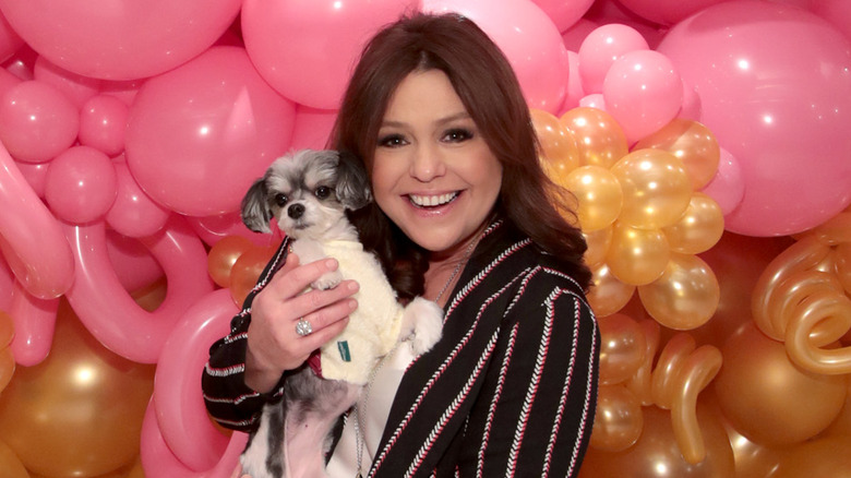 Rachael Ray posing with a dog