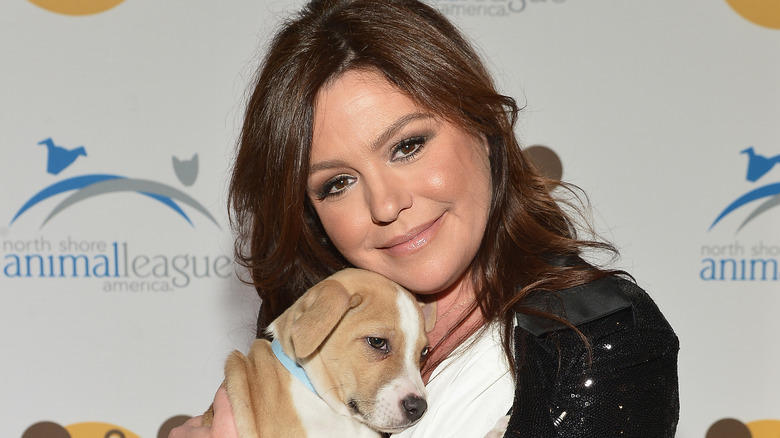 Rachael Ray posing with a dog