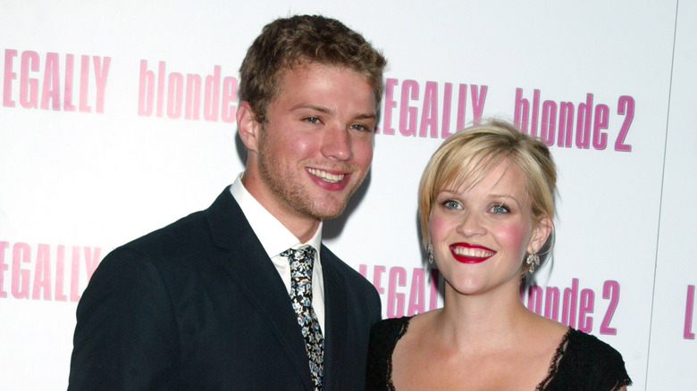 Reese Witherspoon and Ryan Phillippe posing at a movie premiere 