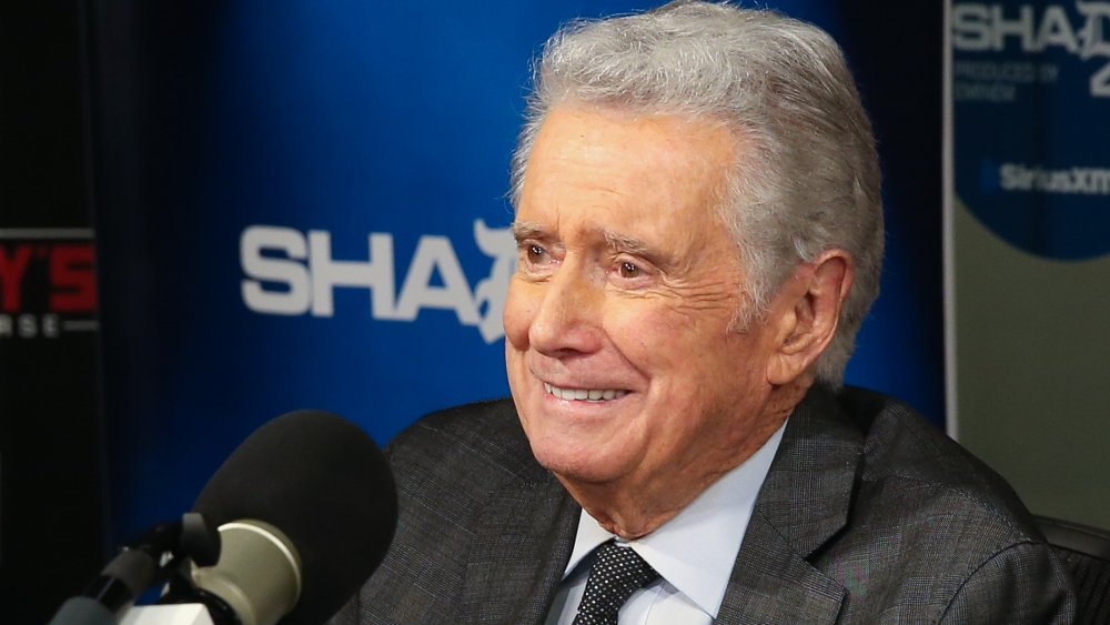 Regis Philbin smiling during a sit-down interview