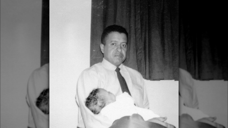 Lawrence Edward Roberts holding baby Robin Roberts