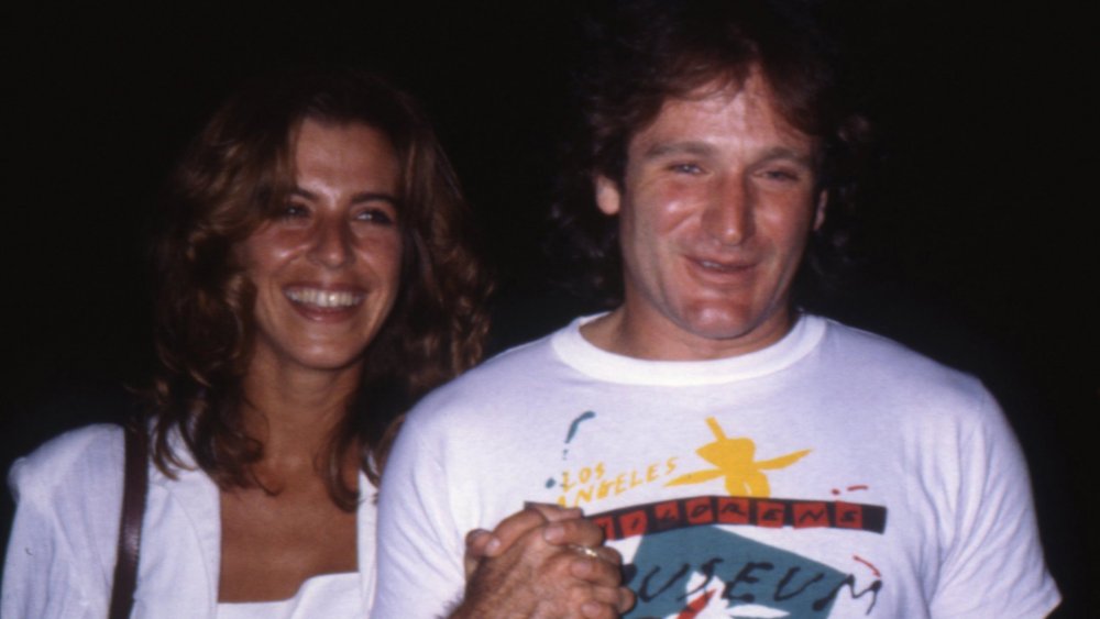 Valerie Velardi and Robin Williams holding hands