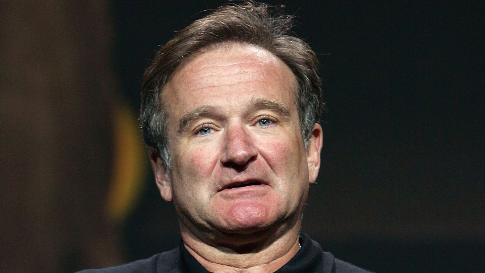 Robin Williams looking straight ahead with a blank expression