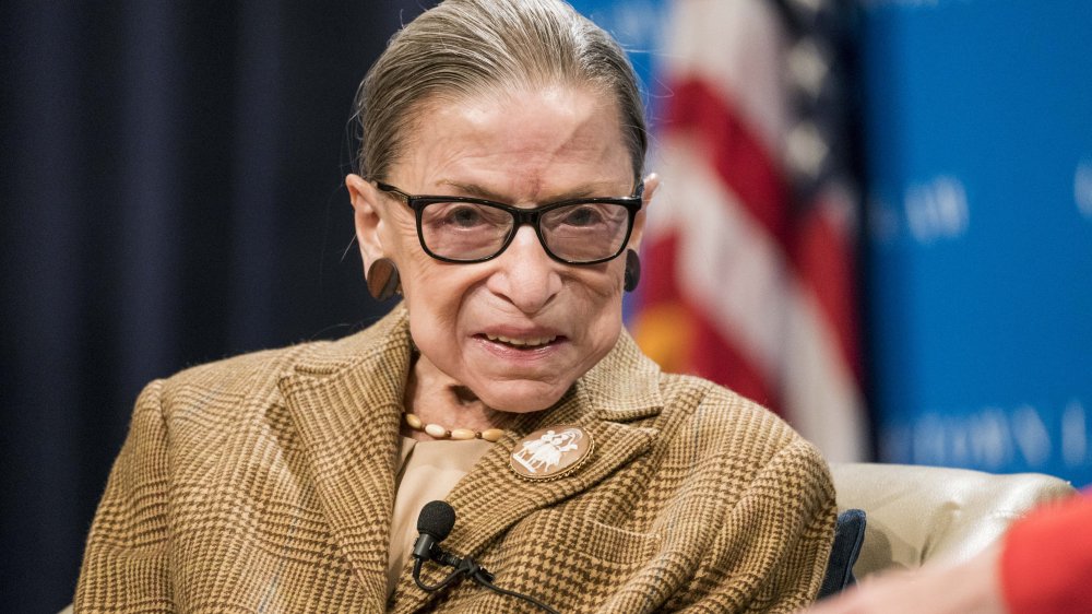 Ruth Bader Ginsburg in a checkered brown blazer