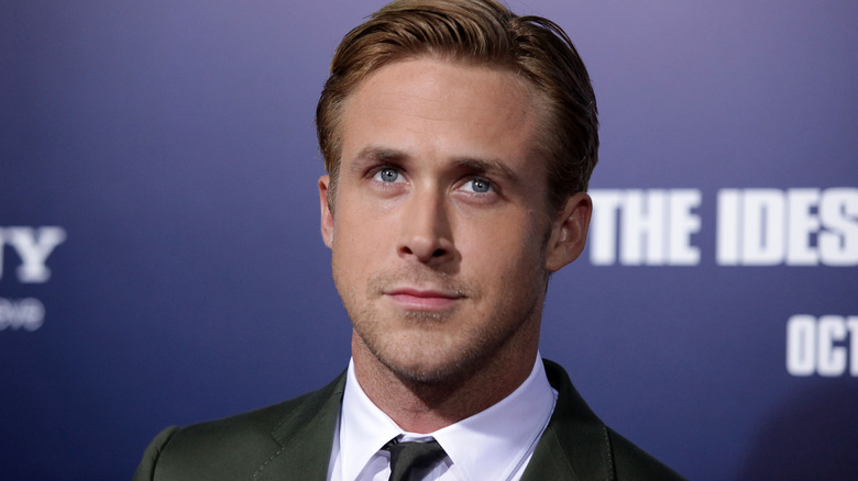 Ryan Gosling posing in a suit