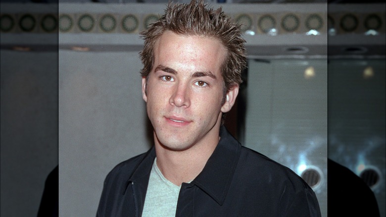 Young Ryan Reynolds posing with a spiky hairstyle