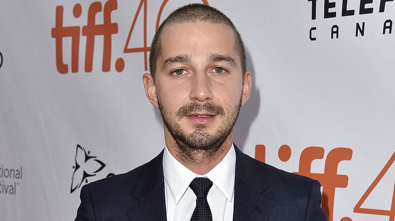 Shia LaBeouf posing in suit