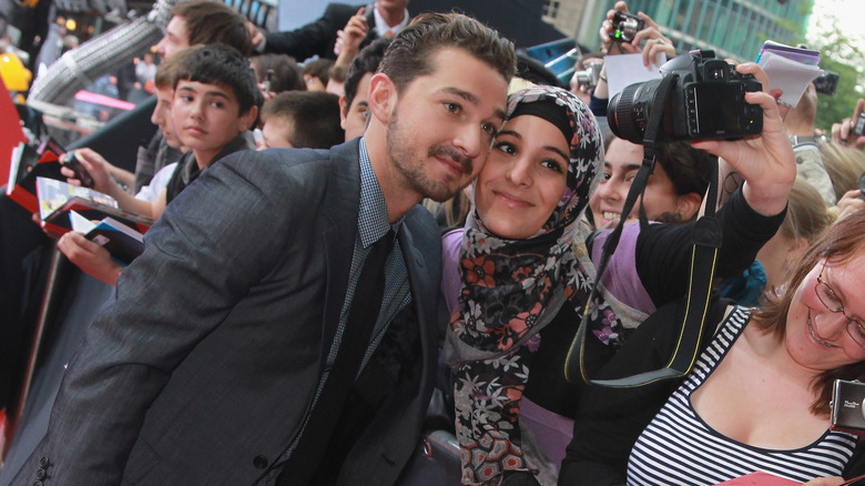 Shia LaBeaouf posing with fans