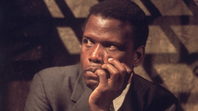 Sidney Poitier holding his face