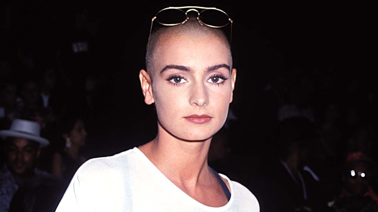 Sinéad O'Connor wearing a white shirt