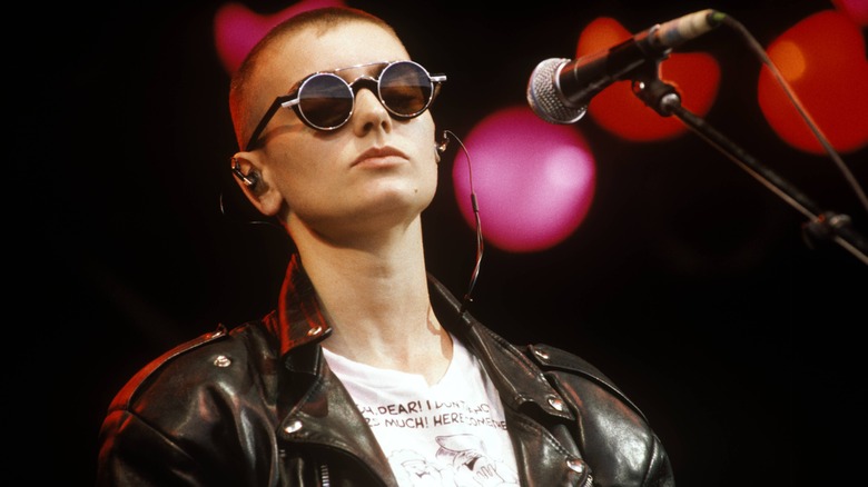 Sinéad O'Connor wearing sunglasses on stage