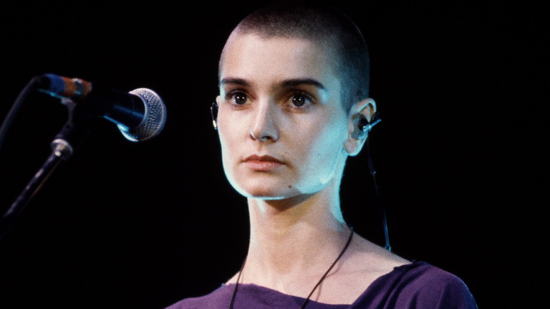 Sinéad O'Connor performs in purple shirt