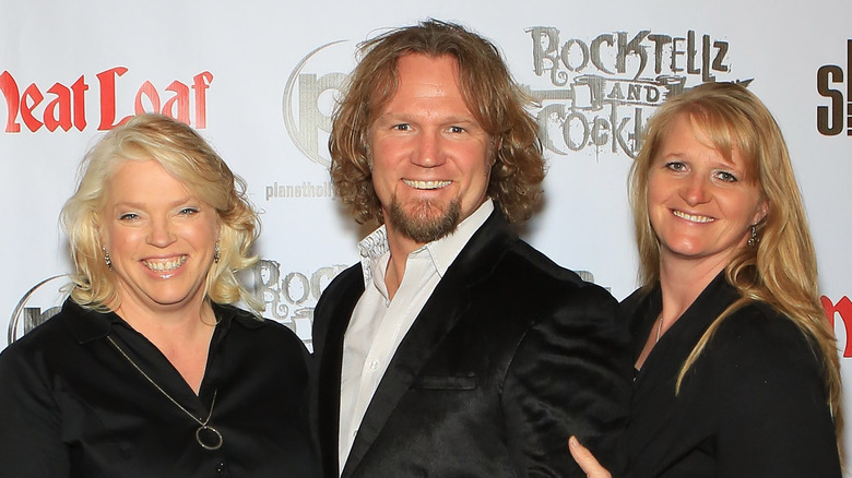 Kody Brown smiling and posing with Janelle and Christine