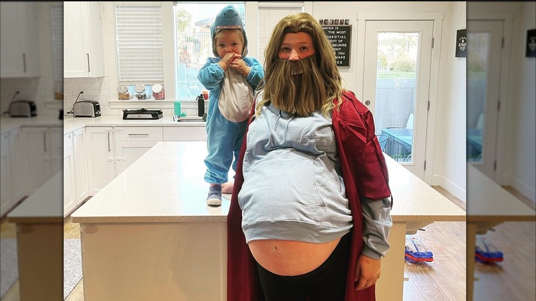 Mykelti Brown flaunts baby bump during Halloween