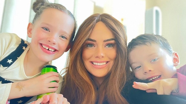 Kathryn Dennis poses with her children