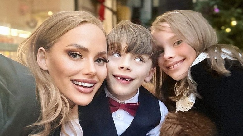 Kathryn Dennis poses with her children