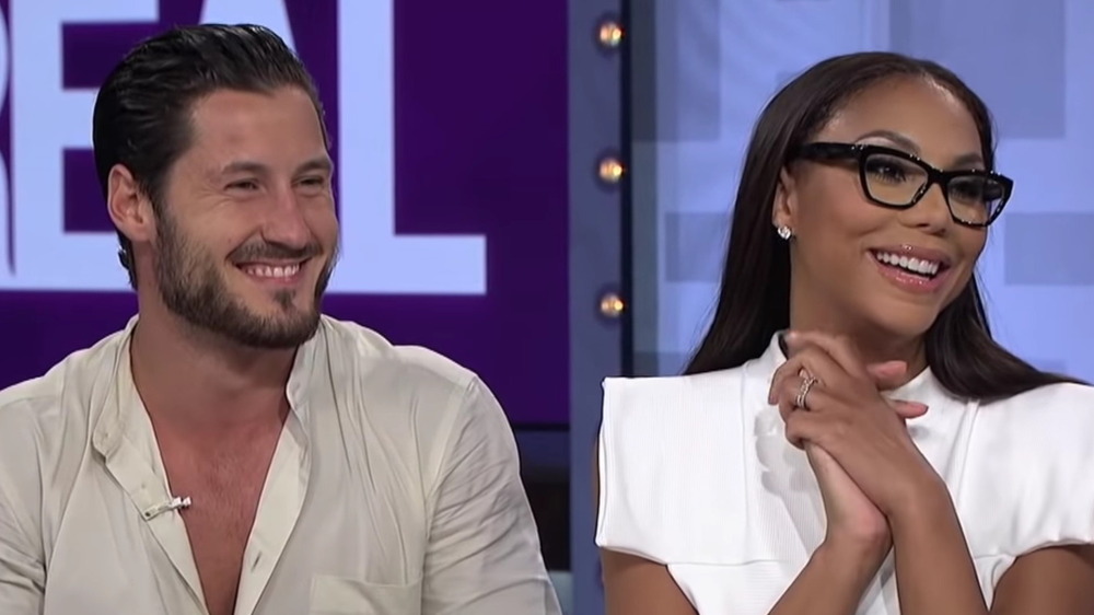 Tamar Braxon and Val Chmerkovskiy, both laughing