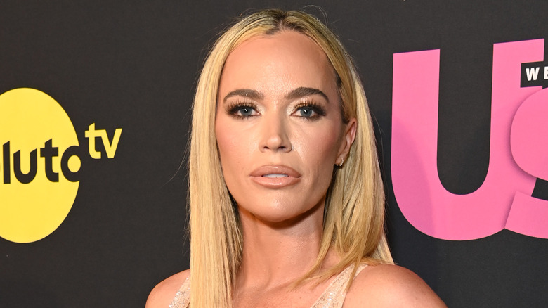 Teddi Mellencamp posing with straight hair