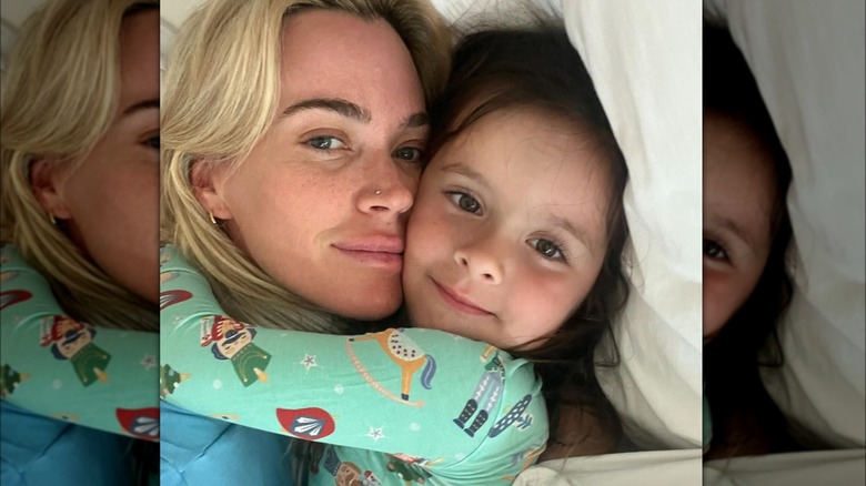 Teddi Mellencamp hugging her daughter Dove