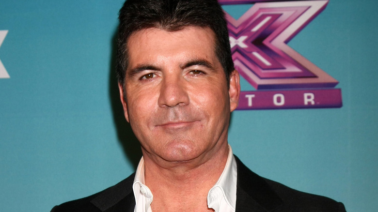 Simon Cowell posing at X-Factor event