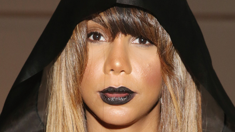 Tamar Braxton hood black lipstick