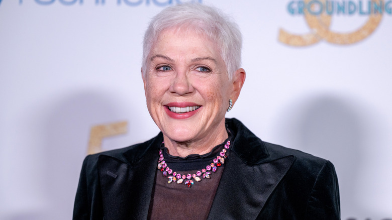 Julia Sweeney smiling for photographers at an event