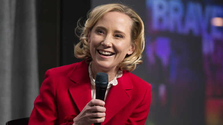 Anne Heche smiling and speaking into microphone